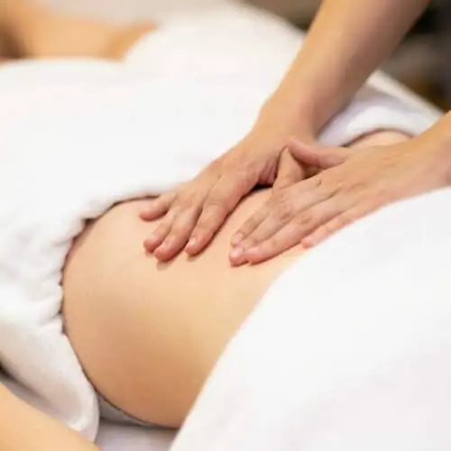 Woman,Receiving,A,Belly,Massage,In,A,Physiotherapy,Center.,Female